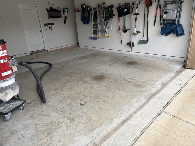 Before: bare concrete garage floor with oil stains in Wylie TX