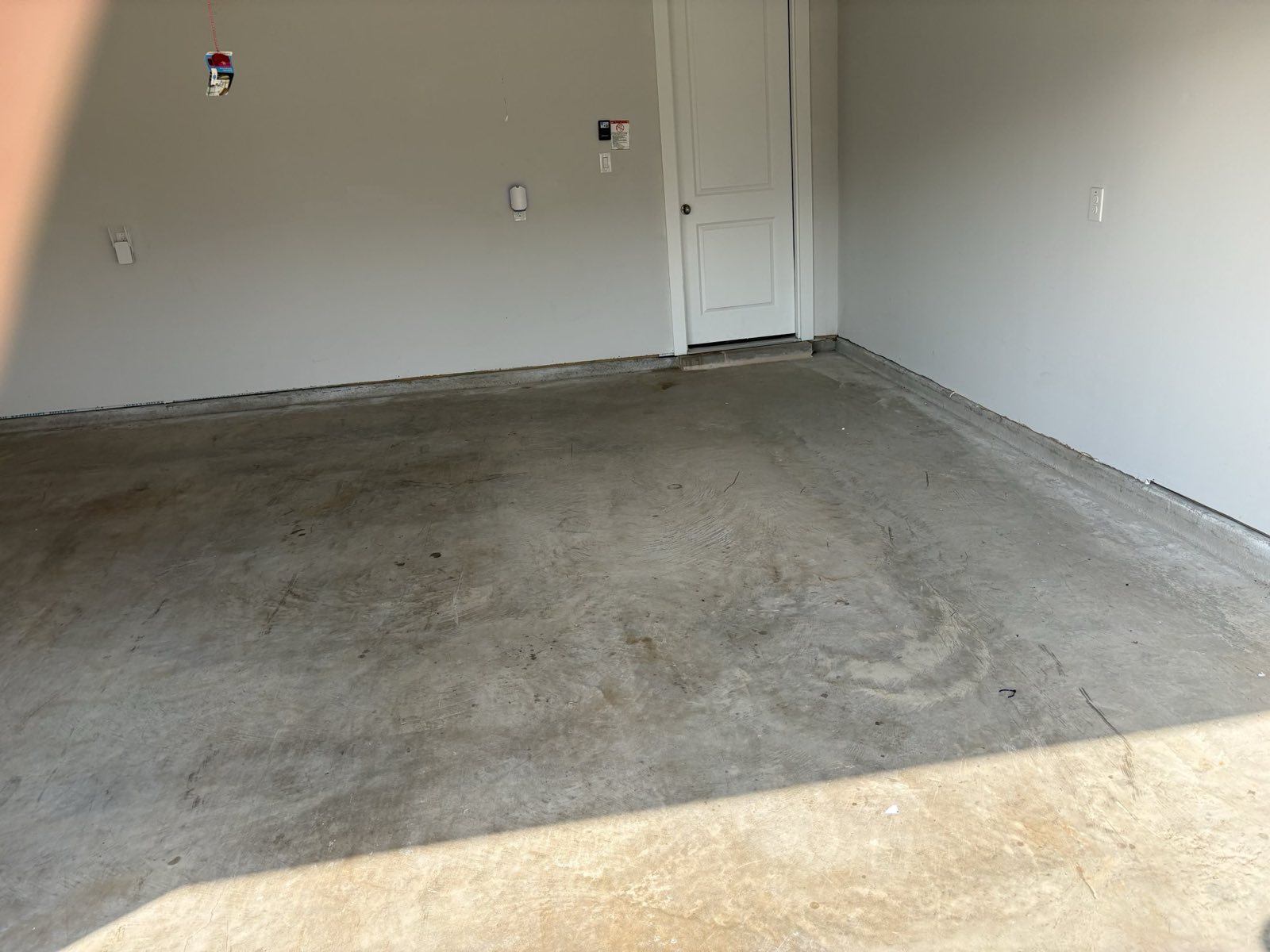 Before: worn concrete garage floor in McKinney TX
