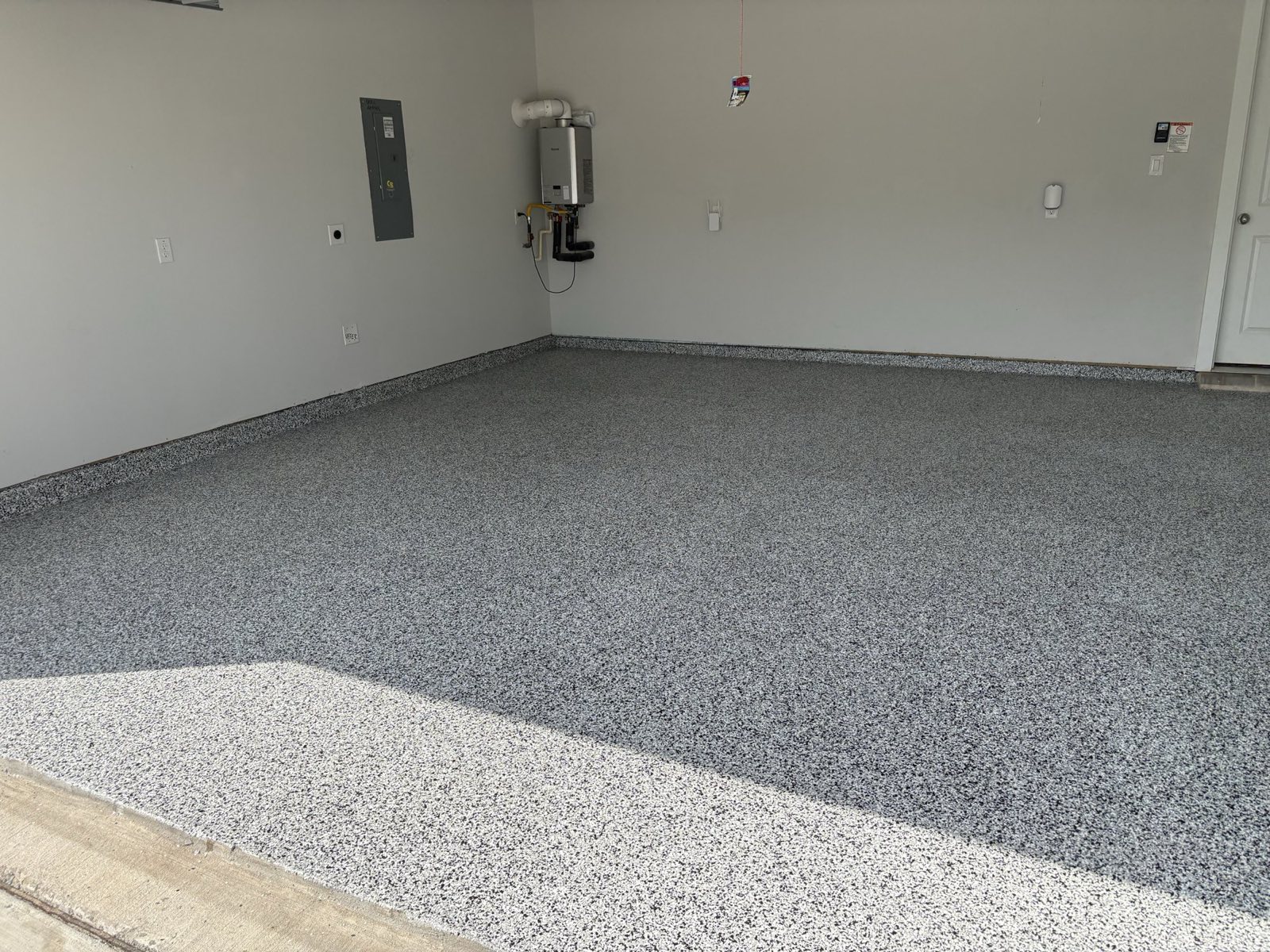 After: Domino flake epoxy garage floor, McKinney TX