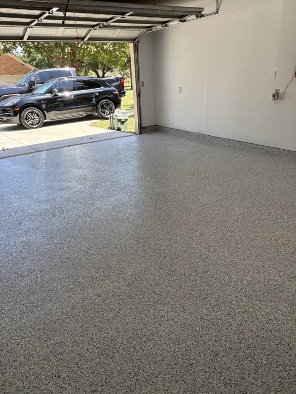 Tidal Wave flake epoxy garage floor seen from the driveway, Lucas TX